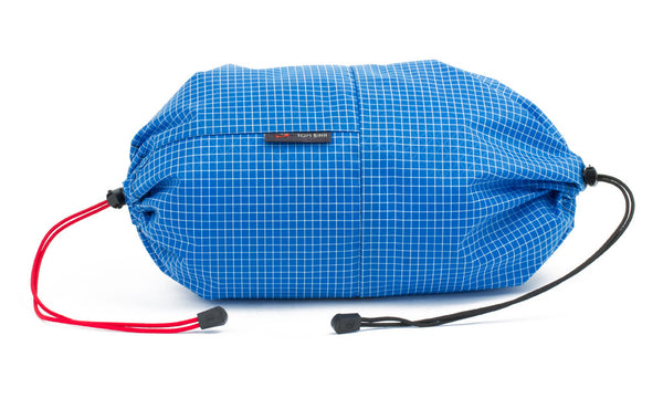 An Aeronaut 45 Travel Laundry Stuff Sack in Island (blue with white grid) 200 Halcyon.